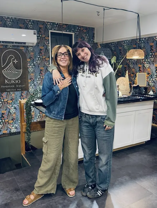 Two students posing together in the studio